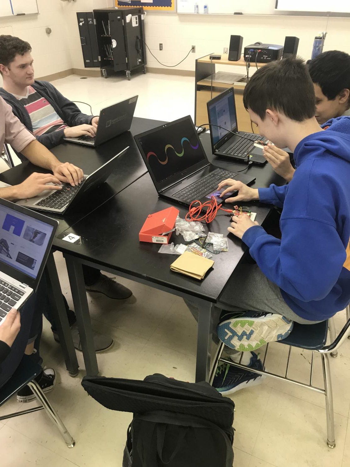 Participating students work on the challenge, creating a a concussion detecting football helmet prototype.