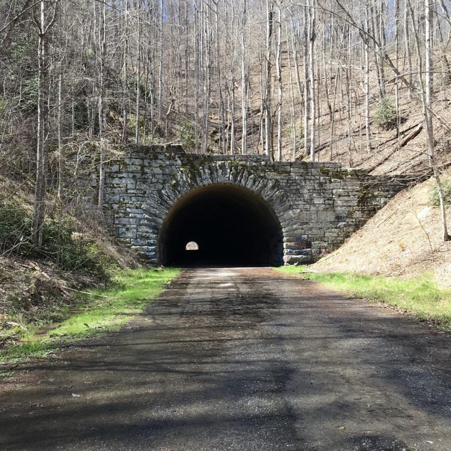 Located near Bryson City, in the Great Smoky Mountains, the Tunnel to Nowhere cuts through the mountain side. The road that goes through the tunnel was originally supposed to go from Bryson City to Fontana, along the Fontana Lake, but was never finished due to environmental problems. The road stops at the other side of the tunnel, where a number of hiking trails can be accessed.