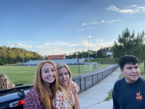 Katelyn Harris, Sierra Freer, and Will Sanchez enjoy the drive through Jaguar Stadium.