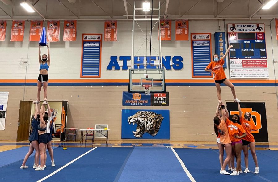 The Varsity cheer team doing a team bonding game in which they try to make the tallest stunt.