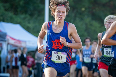 Noah Valyo, sophomore, running in an invitational track meet which was held at the WakeMed soccer park running the 5k (3.1 miles) against other student athletes in Wake County.