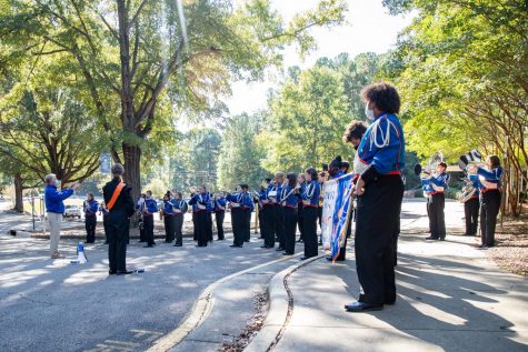 Athens marching band prepares to welcome visitors from the US Department of Education. They were lead from the bands display to the schools outdoor classroom. 