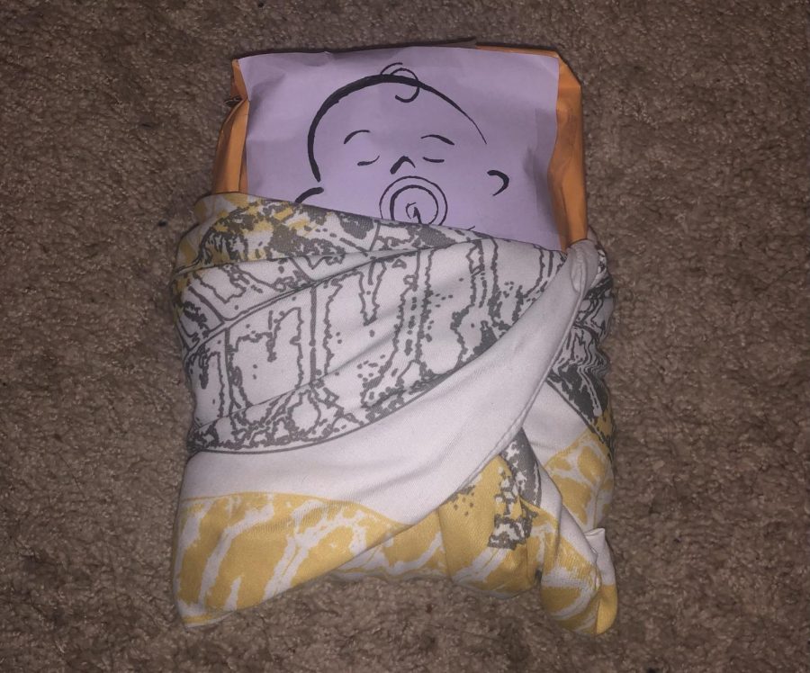 For her project, Mollyne Doresty decided to use a sugar bag wrapped in a blanket with a printed face on.