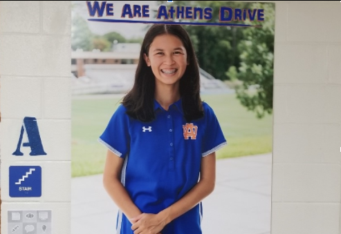 Poster of Holcombe in hallway at Athens Drive High School highlights her success both on and off the field.