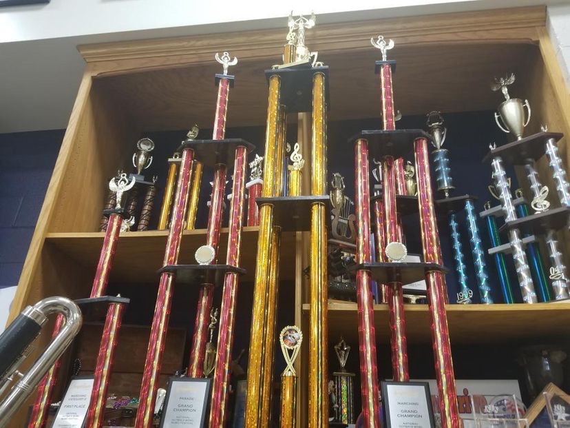 Pictured above are a few of the many trophies earned by the Athens Drive Band being displayed in the band room. Though they represent success, they sit on the shelf collecting dust with no recognition.