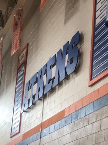 The Athens logo in the upper main gym, where the team plays their home games. The crowd energy here is unmatched and many of the tickets to these games are sold out in a short period of time. 

