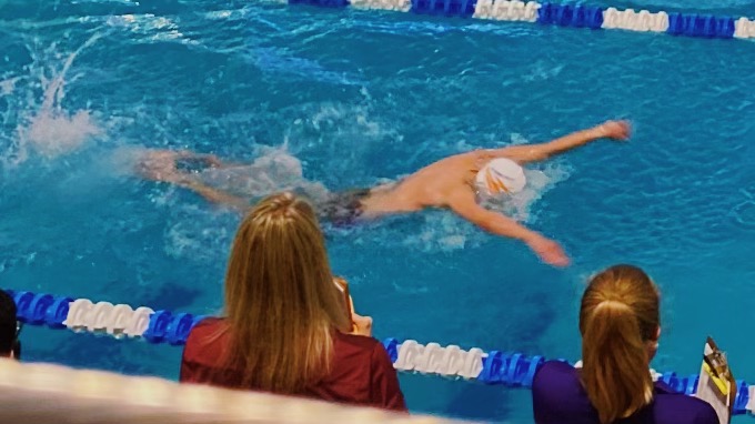 Trevor McDonald, a senior at Athens Drive, swimming the 100 meter butterfly event at the conference swim meet. The Athens Drive mens swim team placed fourth in the new conference. 