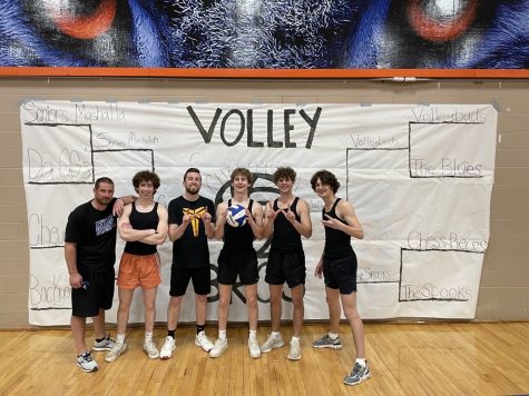 VolleyBros winners Chewblocka pose in front of the tournament poster. Vollybros raised funds for the Haven House charity.