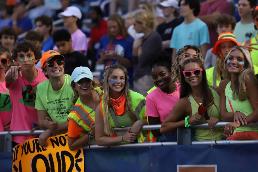 Students dressed in neon and bright colors to support the jags in their battle with Apex. Seniors pictured claiming the fence.