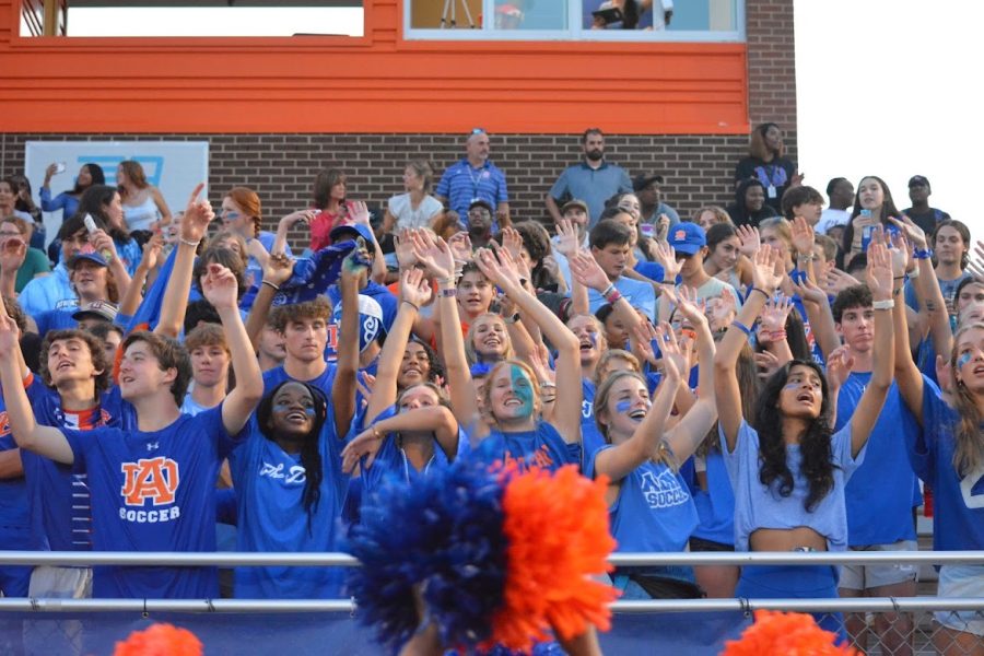 Athens Drive Blue Crew cheering on their football team against South Garner. The student section is dressed in all blue to show spirit.