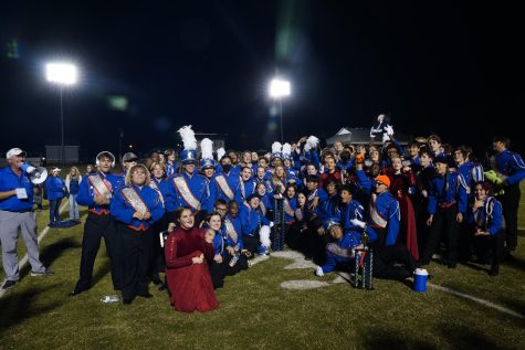 Athens Drive’s Marching Band poses with their “Grand Champion“ trophy at the Western Alamance Band Competition. 