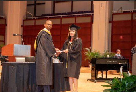 Jennifer Velasquez-Escobar receives her diploma from ECPI university with honors.
