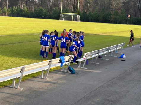 Junior Varsity soccer girls assembling a game plan before the match against Green Hope High School. Here it is showing the competitive and excitement. 