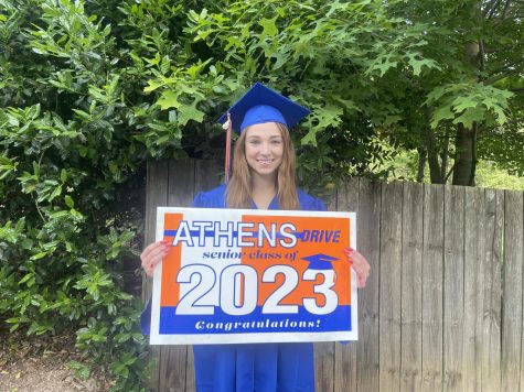 Courtney Richard, senior holds 2023 graduation yard signs,