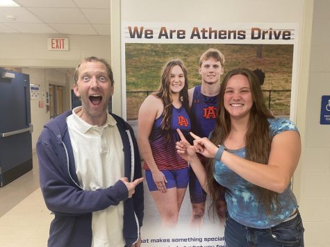 Summer Laskey and Brian Harrington pose next to picture of Laskey hung up in the 2800 hallway. 