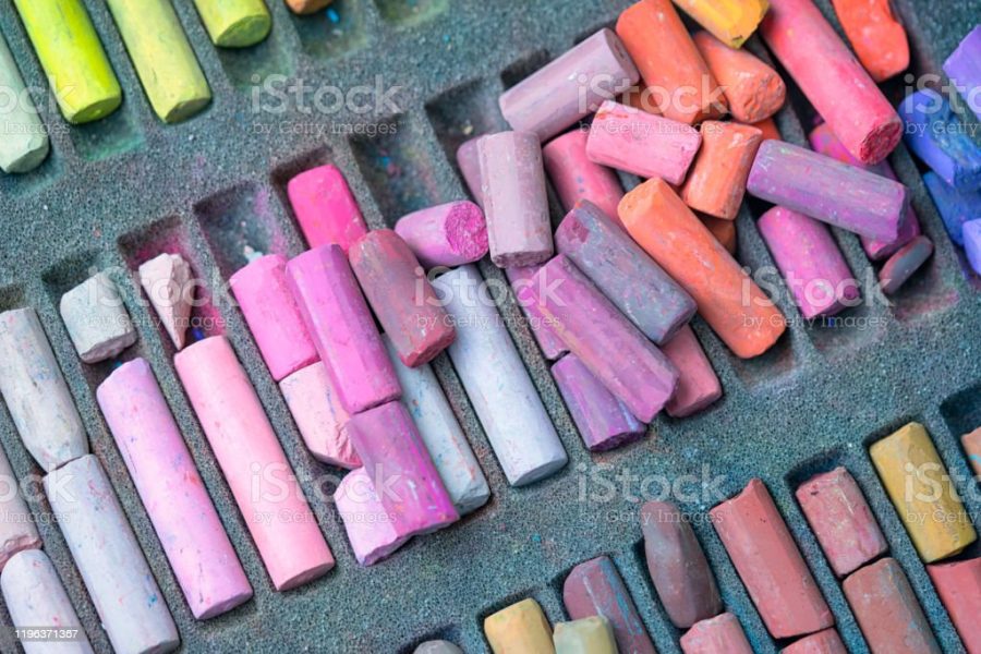 Chalk sticks various colors in a box close up, colorful chalk pastel for preschool children, kid stationary for art painting education.