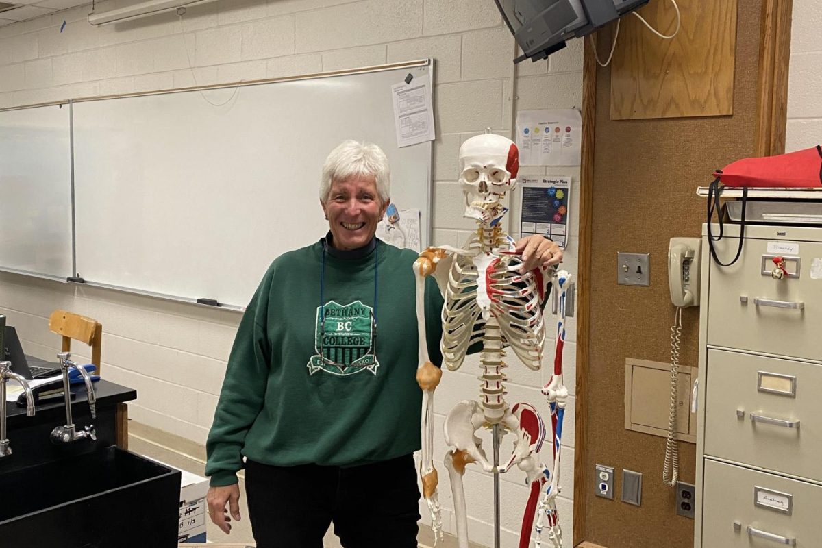 Anatomy+teacher+Mrs.+Wantz+standing+with+her+skeleton+friend.+She+uses+the+skeleton+to+teach+her+class+about+the+bone+structure+of+humans.