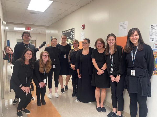 English teachers pictured for Countdown to College Month spirit week. Staff is dressed in all black to celebrate twin day.