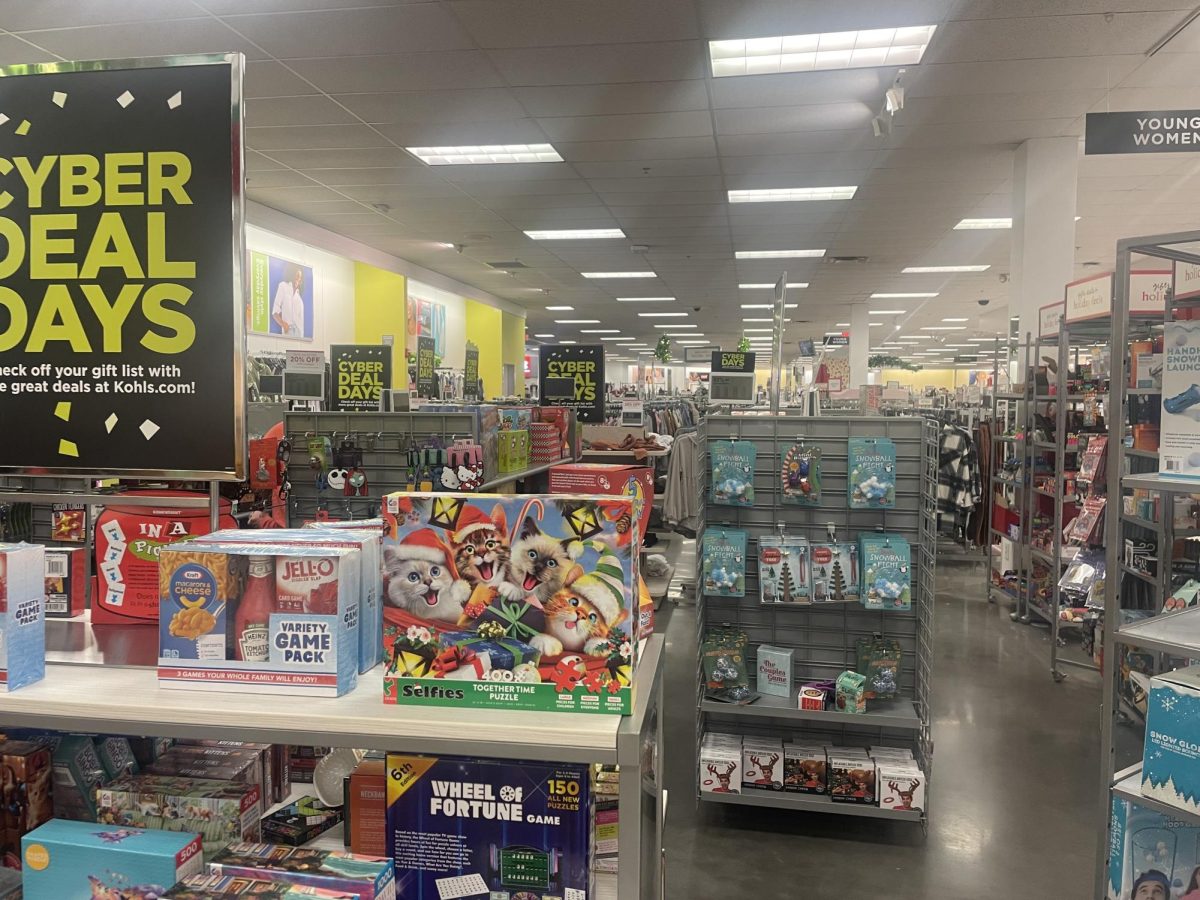 Shelves are stocked with items along with several Black Friday Deals signs above them. It is common for stores to advertise their items with black friday signs