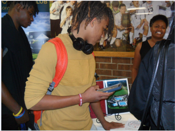 In this picture you have students Tyrre Hester a sophomore and Caleb Jones junior checking out one of the many career fair booths at the Athens Drive career fair.
