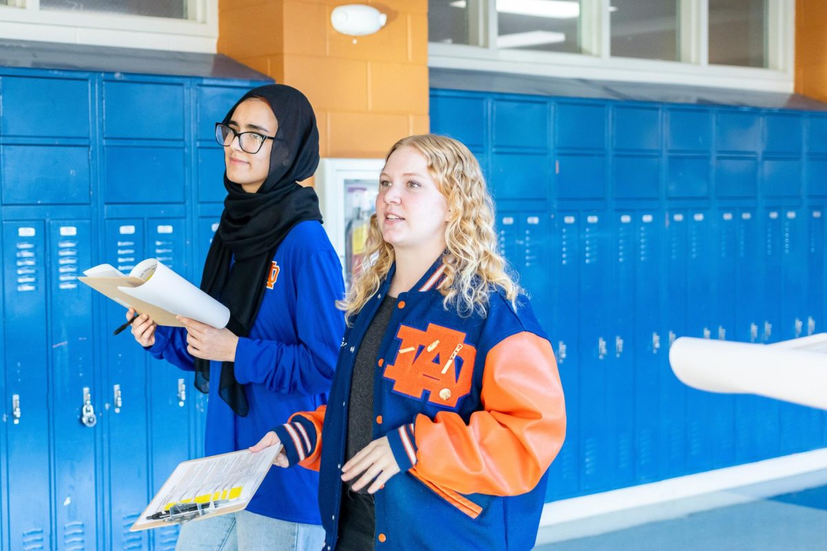 Susan McGraw and Leya Arikat flaunt Athen’s gear as they give a detailed tour of the school. The pair steps up to aid in making certain the Magnet evaluators from Magnet Schools of America have a positive experience. 