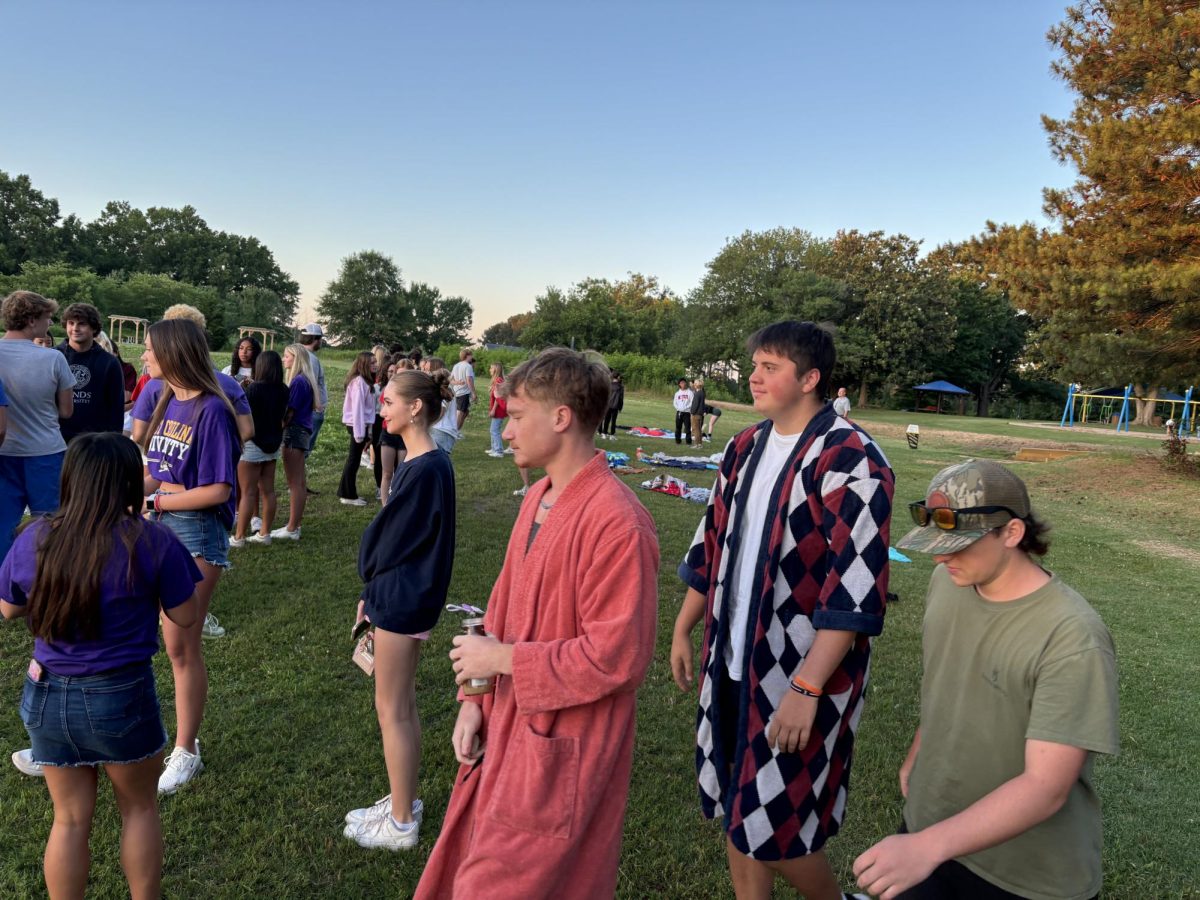 Seniors gather together at Dorothea Dix Park to watch the sunset. Some seniors wear robes to keep themselves from the early morning cold. 