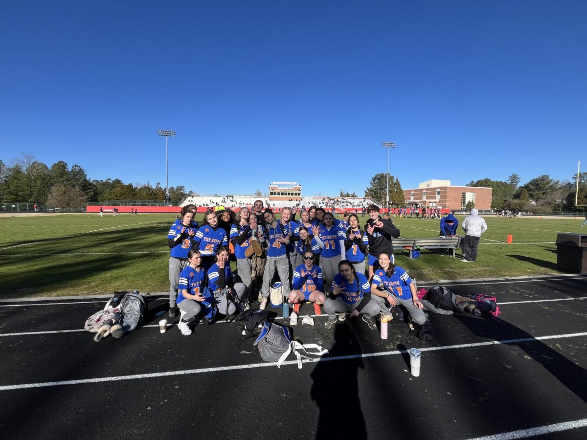 The Athens Drive Flag Football team celebrates after their win against East Wake High School. This was the second game day, and it determined whether they would make it to the Sup-Her-Bowl
