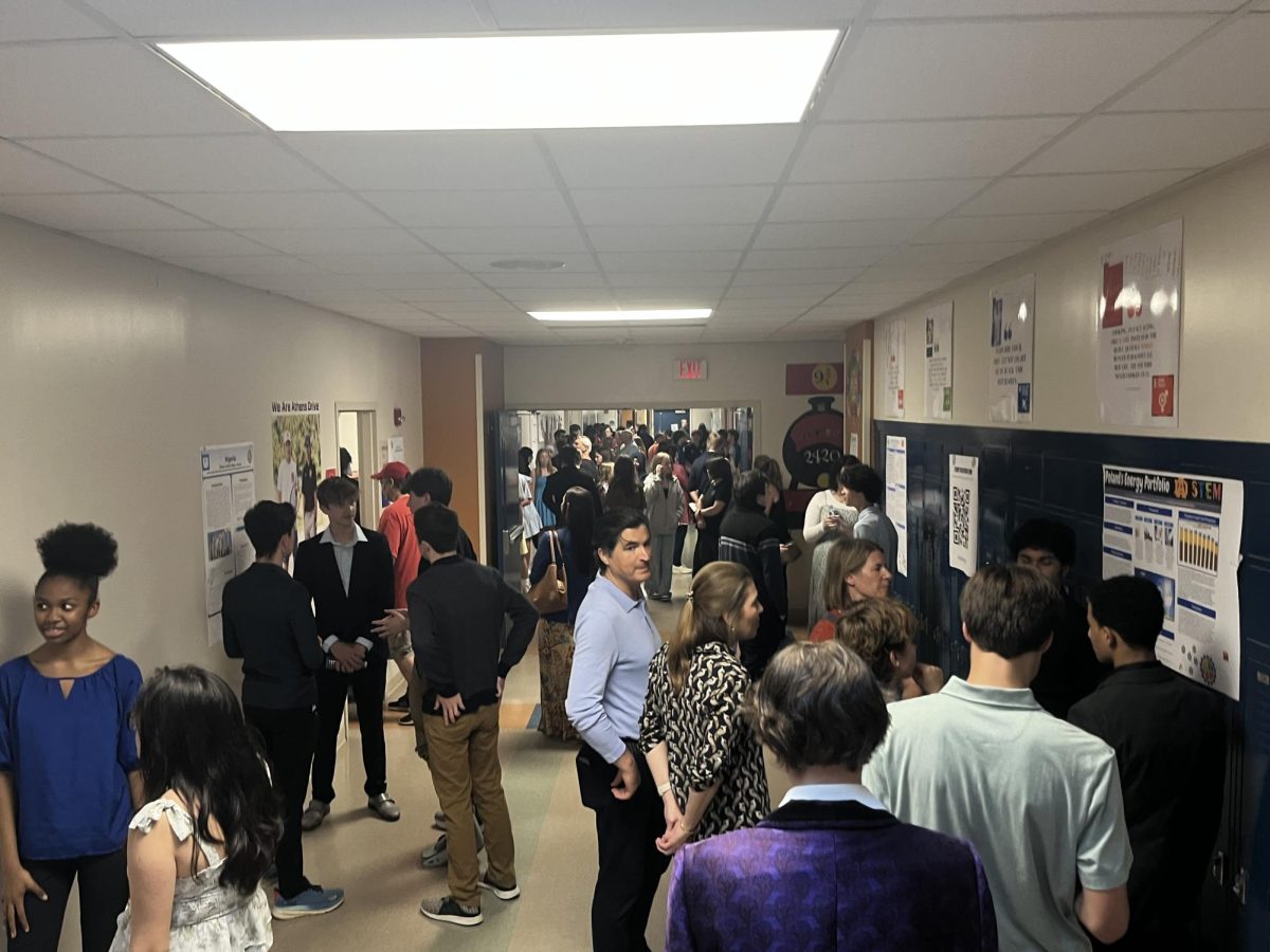 Students walk around to view peers STEM projects. Students spent much of the event viewing projects as well as presenting their  own.