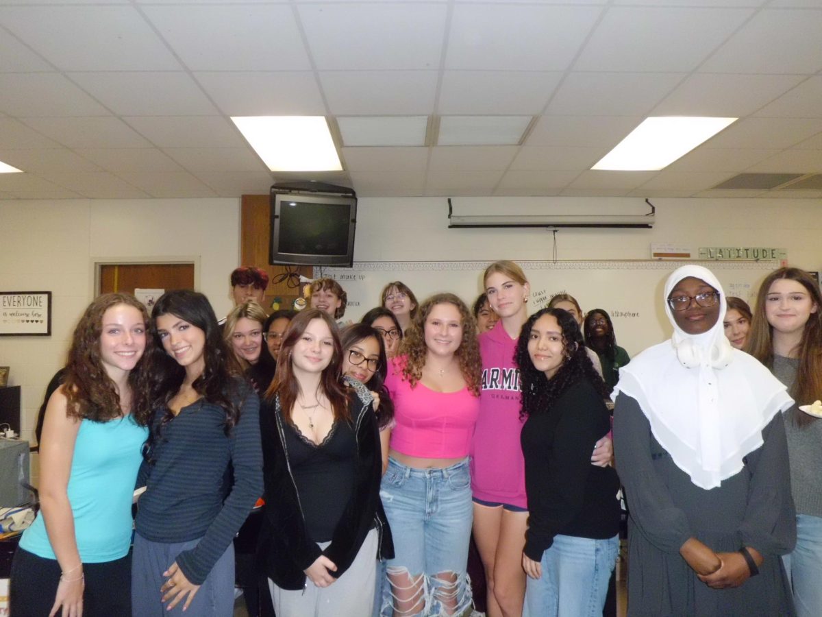 A picture of all club members and presidents in Women's Empowerment. Everyone is getting ready to paint their rocks for breast cancer awareness month. Photo courtesy by Ashley Jaquez 