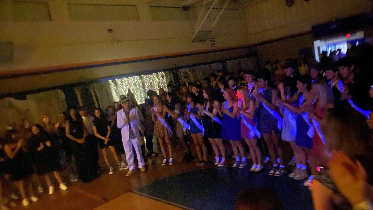 2024 homecoming court lining up, waiting to find out who the Homecoming Queen is. Susan McGraw was crowned Queen that night.