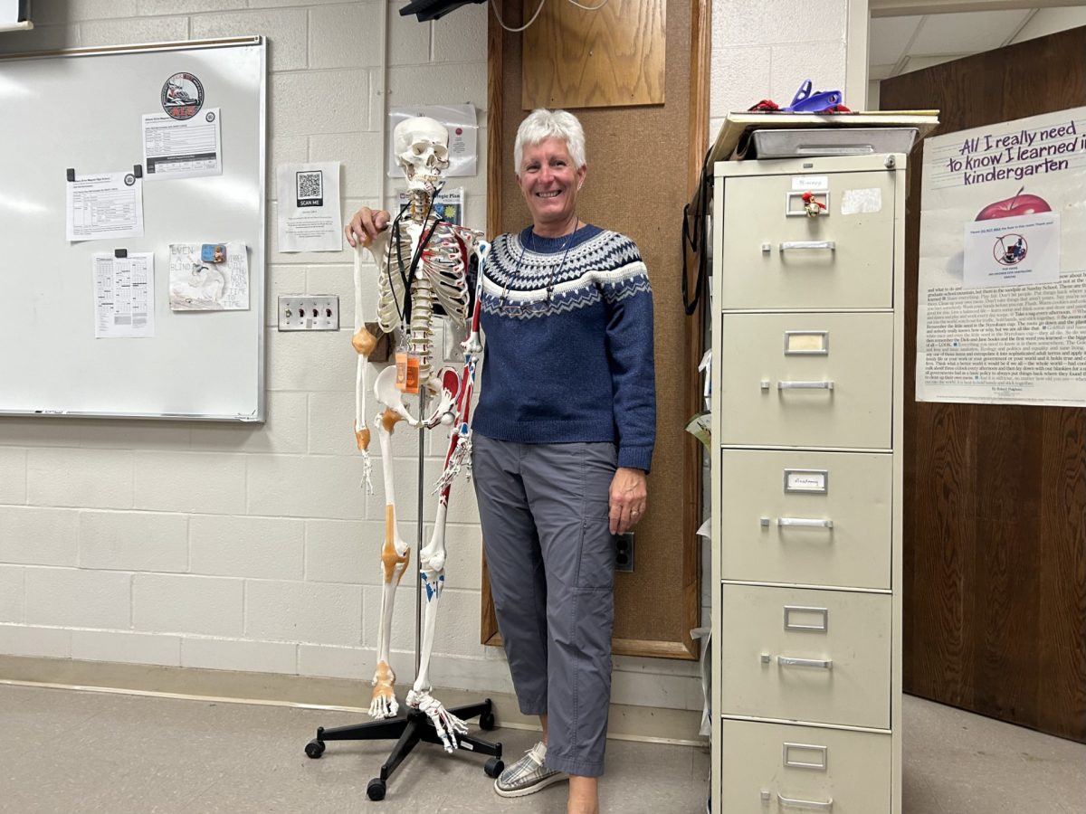 Wantz posed with her skeleton in her science classroom, her gleaming smile represents her excitement for retirement.