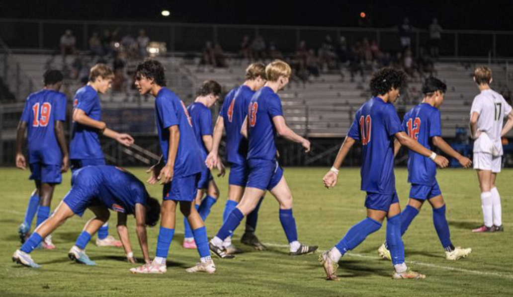 Athens boys varsity team in action on their home field, showcasing their skill and teamwork in a thrilling match. The players are giving their all, competing with determination and spirit. Photos courtesy of Zane Perryman.