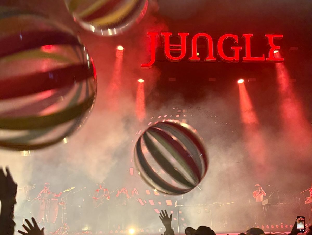 Concert attendees jumping to bounce the beach balls thrown into the crowd. The band “Jungle” has a very groovy vibe which matched the stage. Photo Courtesy of Nora Richards