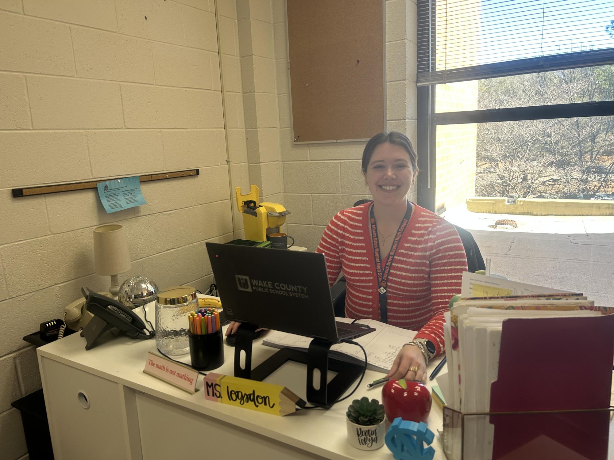 Elizabeth Logsdon photographed working at her desk in her office.  Throughout the process of completing her internship Logsdon continues to teach and grade papers when she is not working toward her 700-hour internship requirement. 