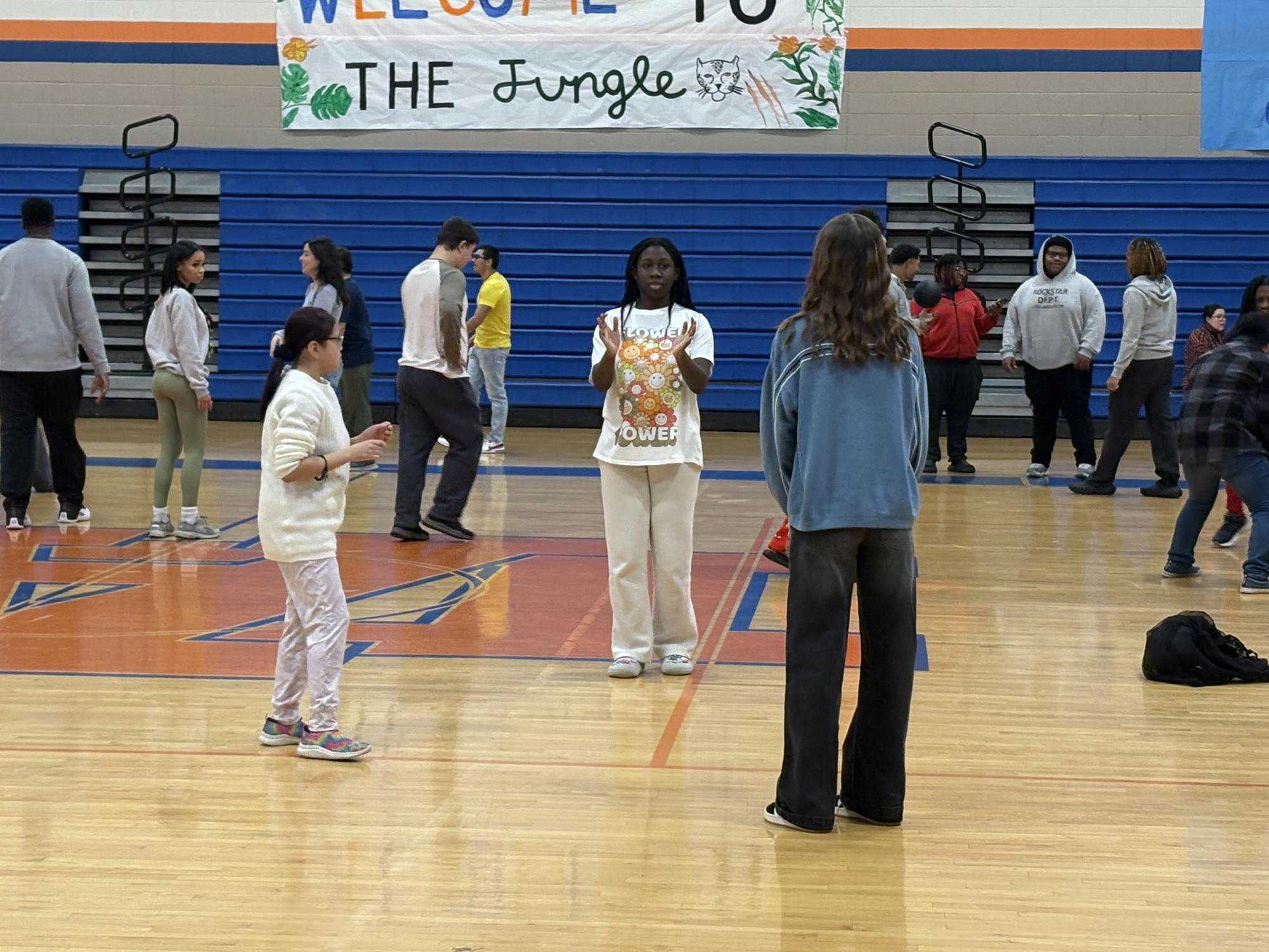 PEPI Students pass a ball around with their peers. While everyday, PEPI Students will help with warm-ups, the daily activity will change, creating an exciting curriculum for all students. 