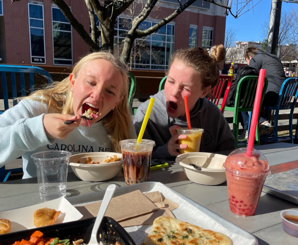 Nora Richards and Harper Lucas enjoying their lunch at Morgan Street Food Hall. The girls got Mediterranean rice bowls and boba. (Photo Courtesy of Angelina Lu)