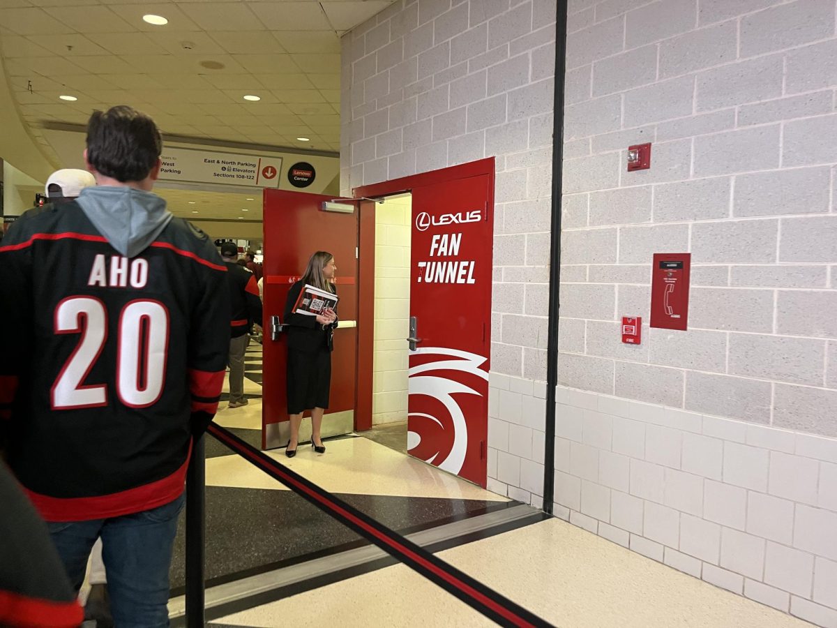 The entrance to the fan tunnel opens up before the game starts. Season ticket members get randomly selected for the opportunity to stand along the hallway where the players walk onto the ice, giving high-fives and fist bumps to the team as they exit the locker room.