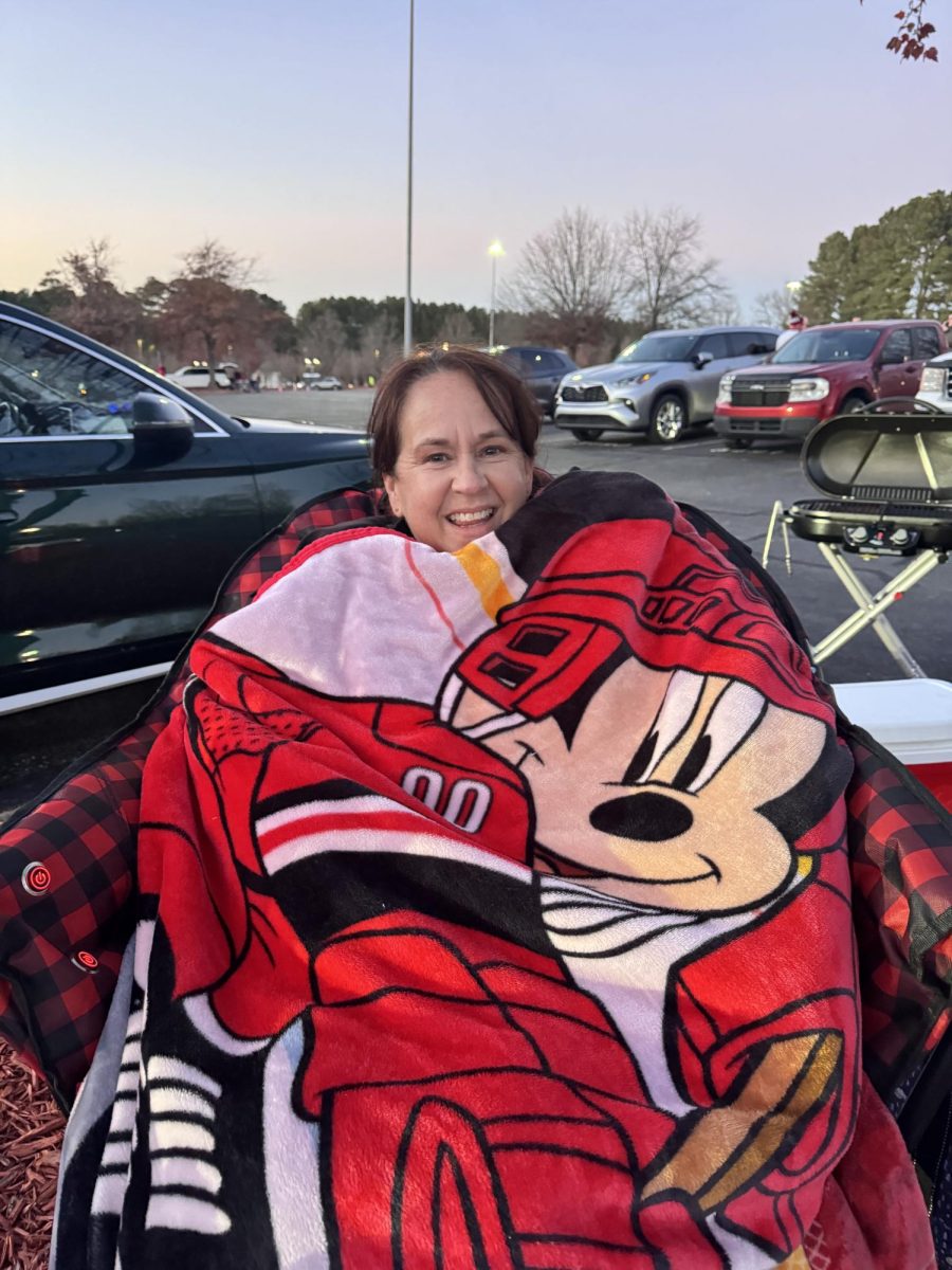 Hurricanes fan cozies up with a hockey blanket. She was pictured tailgating before the Nov. 11th game against the Washington Capitals