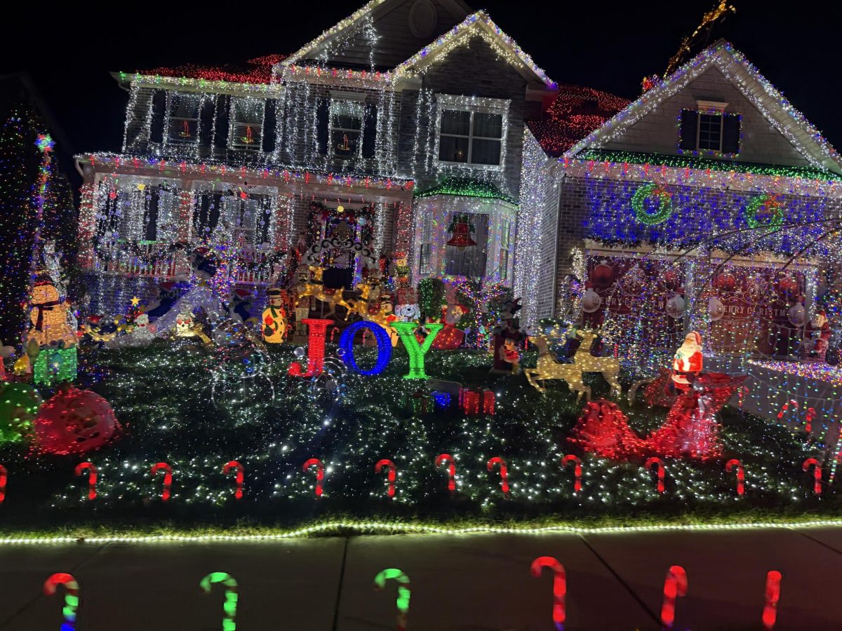 Elaborately decorated Christmas home located in Rolesville. The home features a creative mix of many different, colorful lights and character statues. 