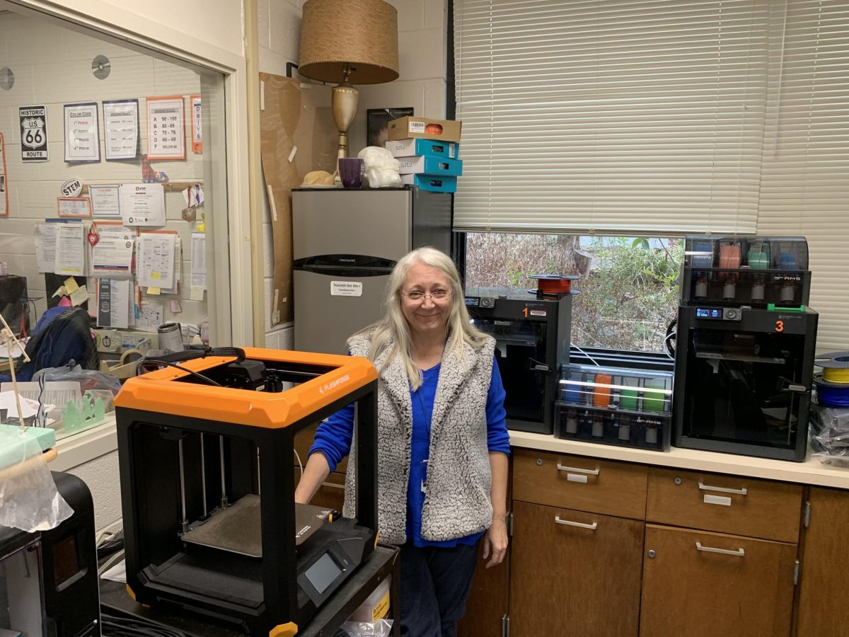 Nato in the 3D printing room working on prints. She works hard to ensure everything runs smoothly.