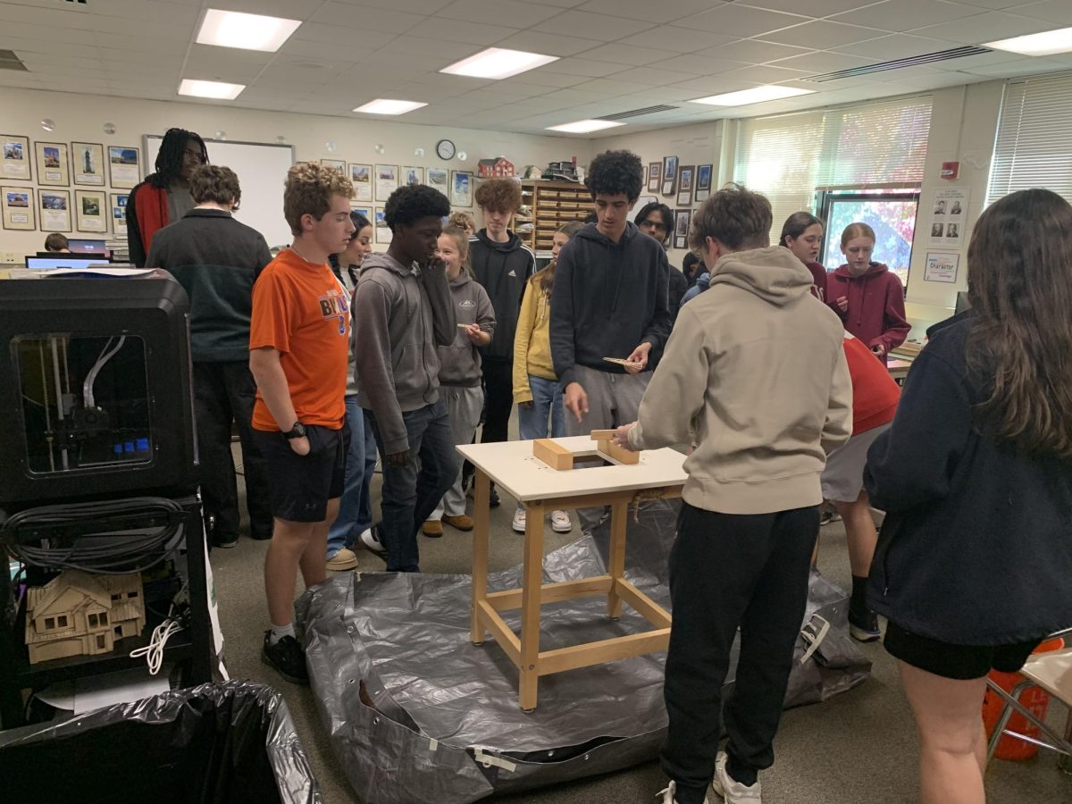 Mrs. Nato’s 3rd period class on the last day of the semester. They are testing out wooden bridge models that they made.