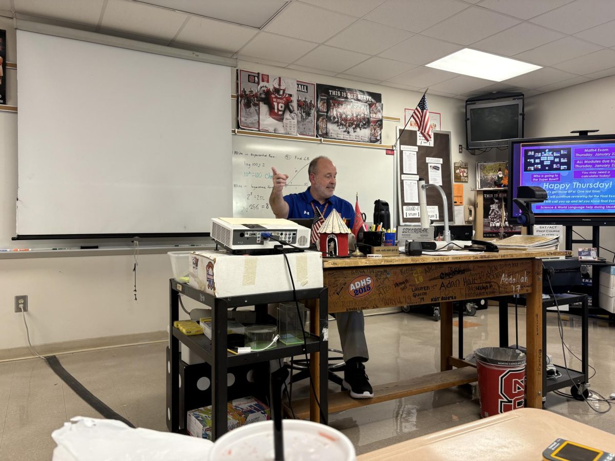 Math Teacher Christopher Remaley sitting in his 4th period math 4 class. Teaching his students while they are learning a new module. 