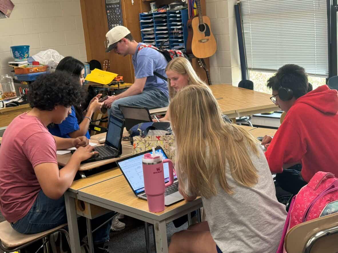 Libby O' Leary and her group leaders work together on their STEM project. Prior to this, they had been working on the physical structure of their project, which was the making of a catapult.
