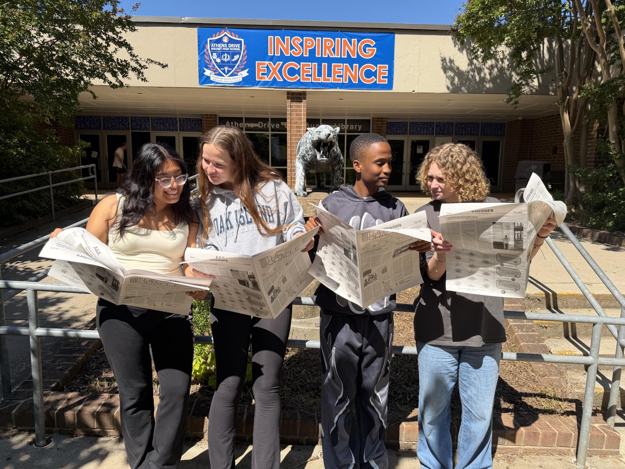 Yemileth Salazar-de La Cruz, Rowan Bissett, Elijah Hoskins and Ella Johnson all stand proudly looking at the Oracle Print. After the COVID-19 pandemic stopped production of the print six years ago, the paper came back into production to being news to Athens Drive. 
