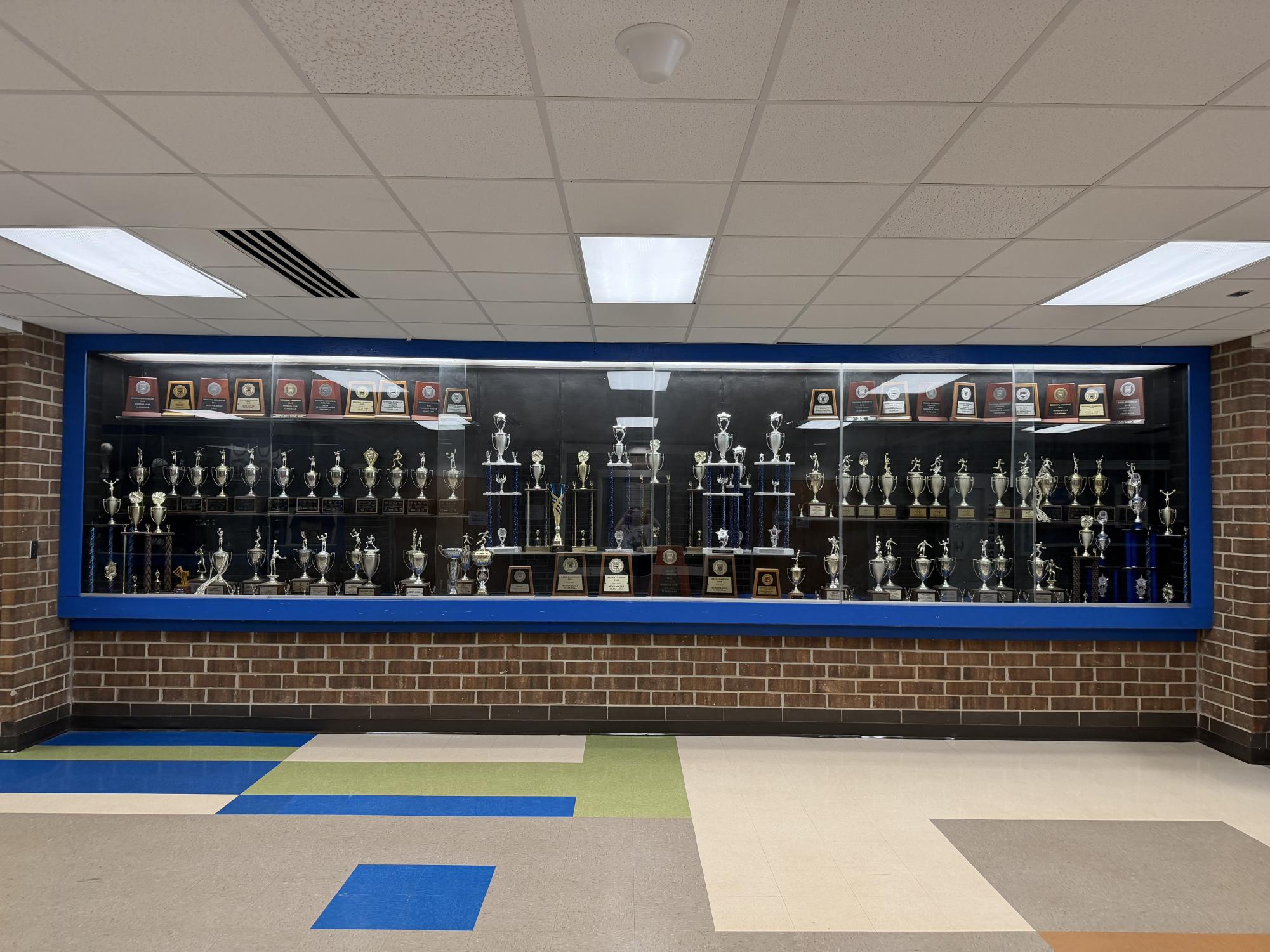 The Athens Drive Trophy case is one of the first sights you see as you enter the school. It showcases several different athletic wins, such as state titles or conference championships. 